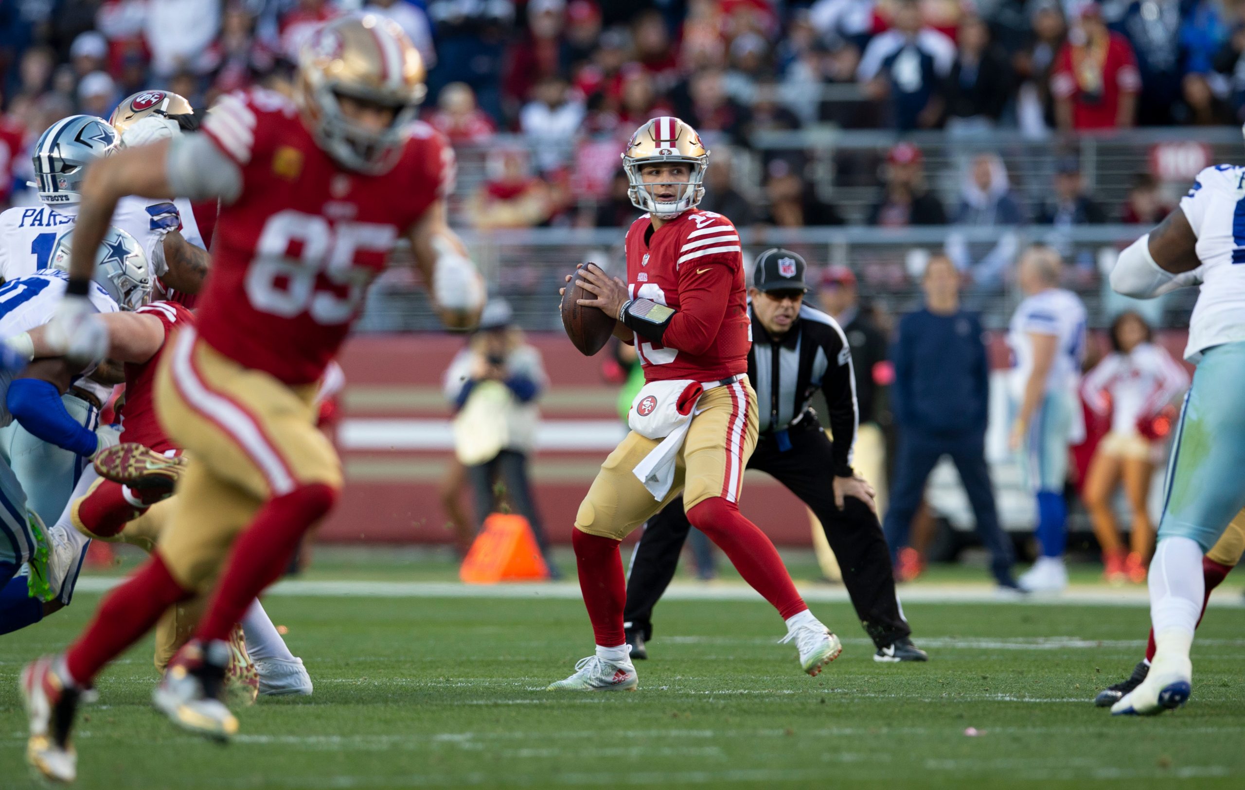 Brock Purdy #13 of the San Francisco 49ers passes during the NFC Divisional playoff game against th...