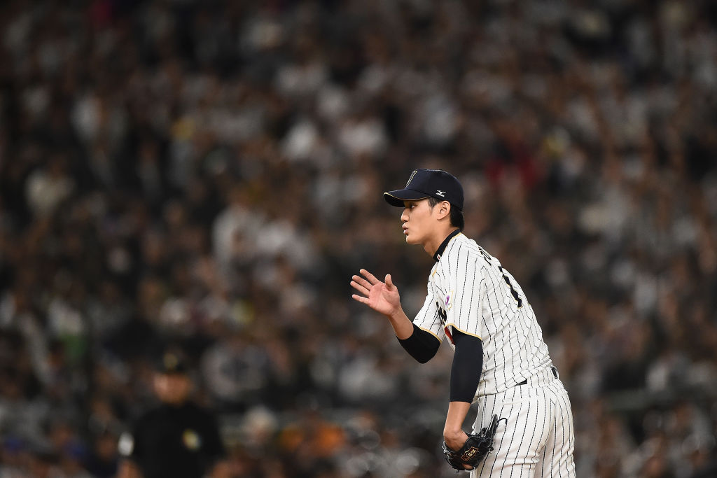 Pitcher Shintaro Fujinami #17 of Japan signals in the top of the fourth inning during the World Bas...