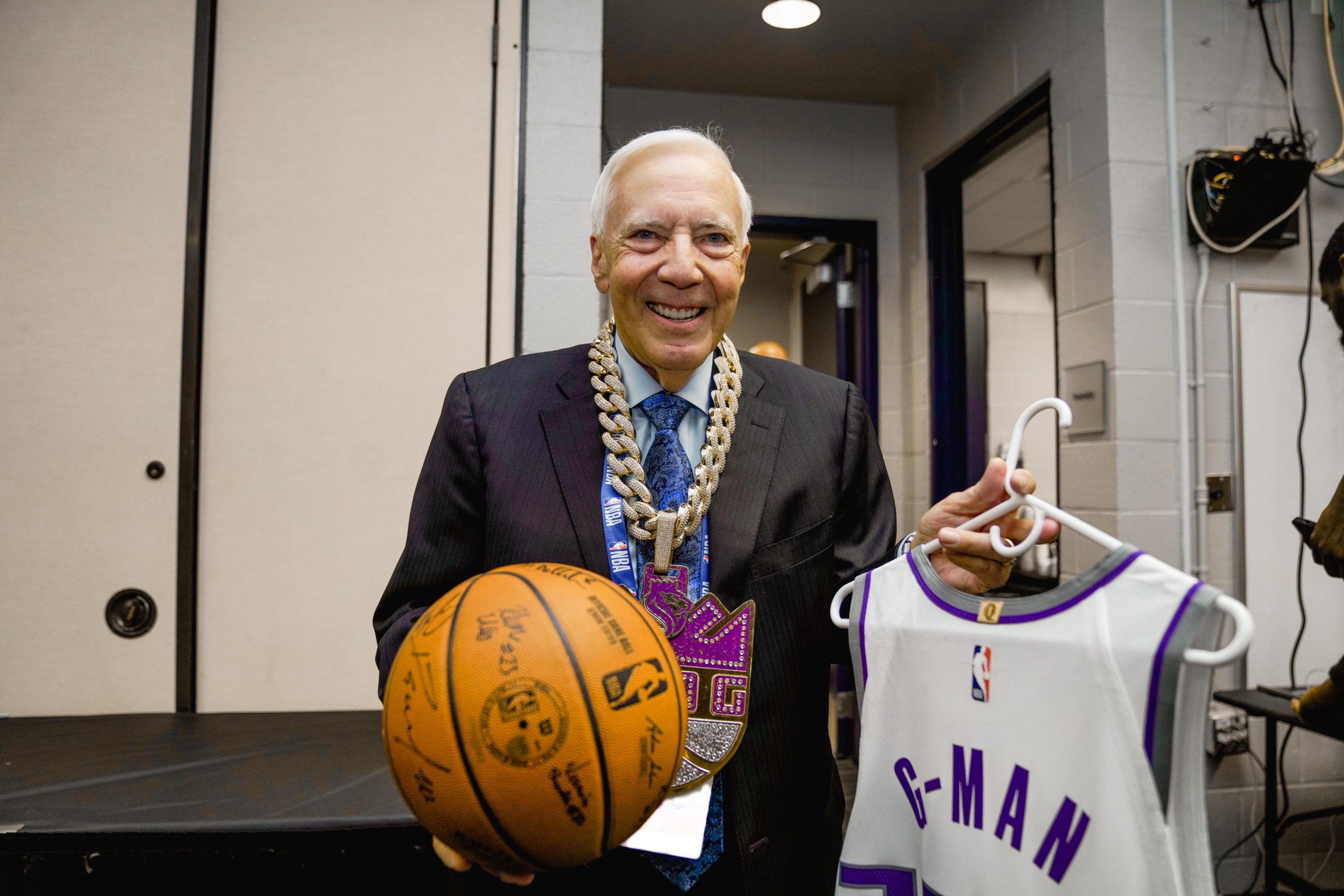 Gary Gerould with the game ball, custom jersey and Defensive Player of the Game chain after calling...