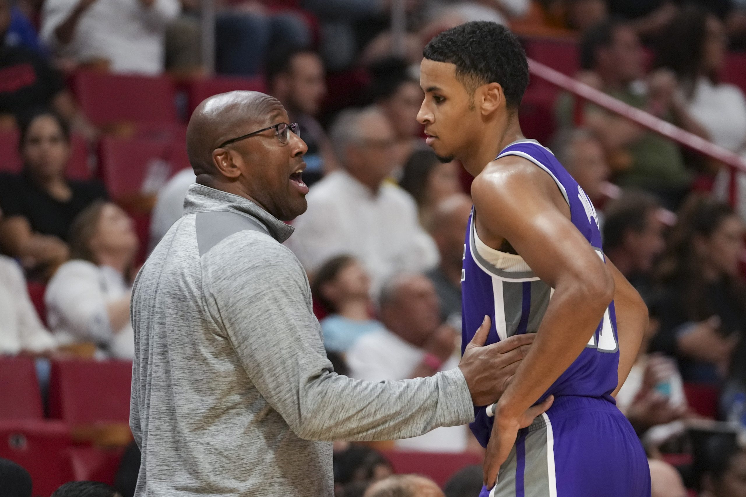 Head coach Mike Brown of the Sacramento Kings talks with Keegan Murray #13 during the second half a...