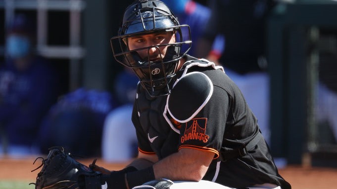 Catcher Joey Bart #21 of the San Francisco Giants during the MLB spring training game against the T...