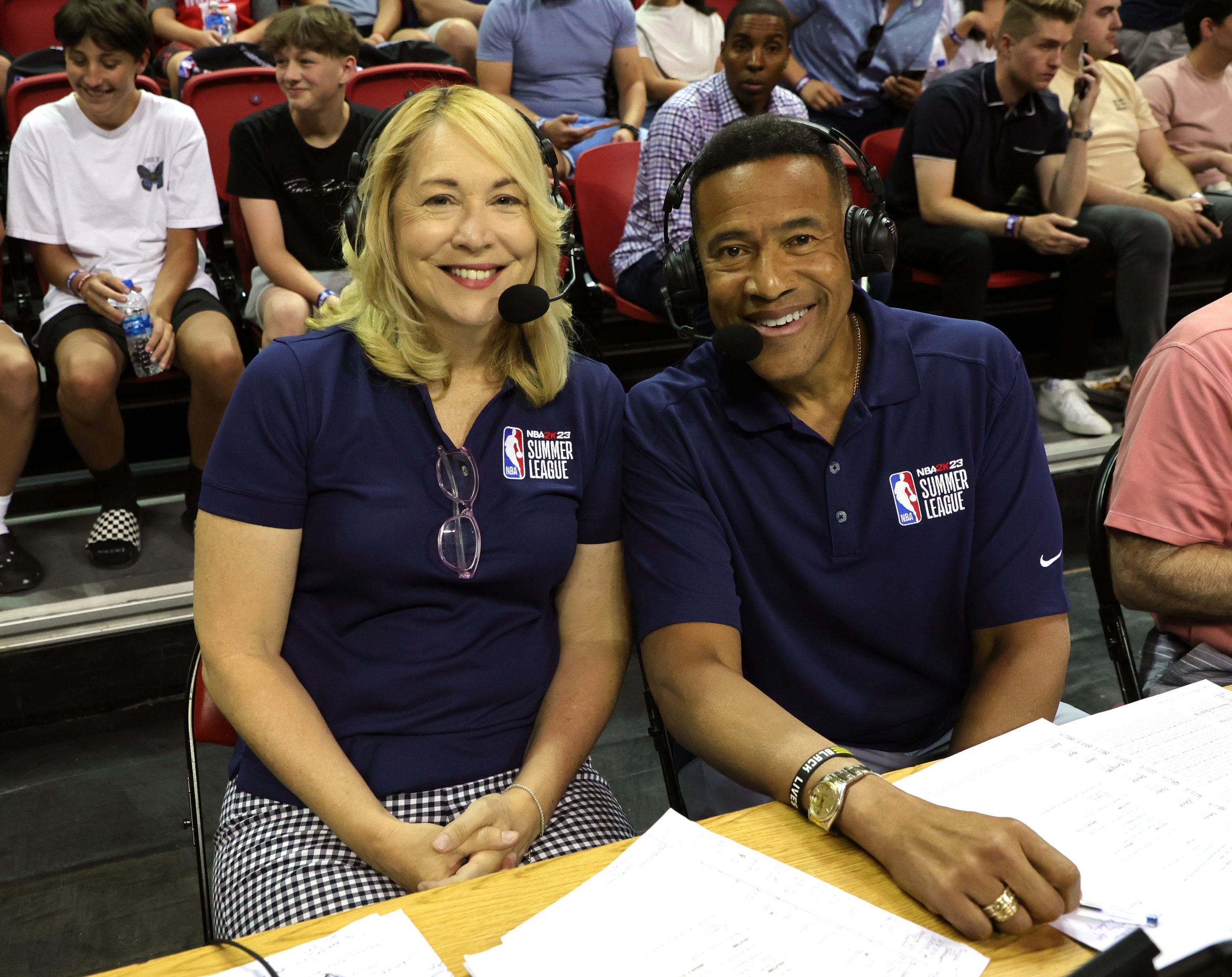 ESPN sports announcer and analyst Doris Burke (L) and sportscaster Mark Jones pose before calling a...
