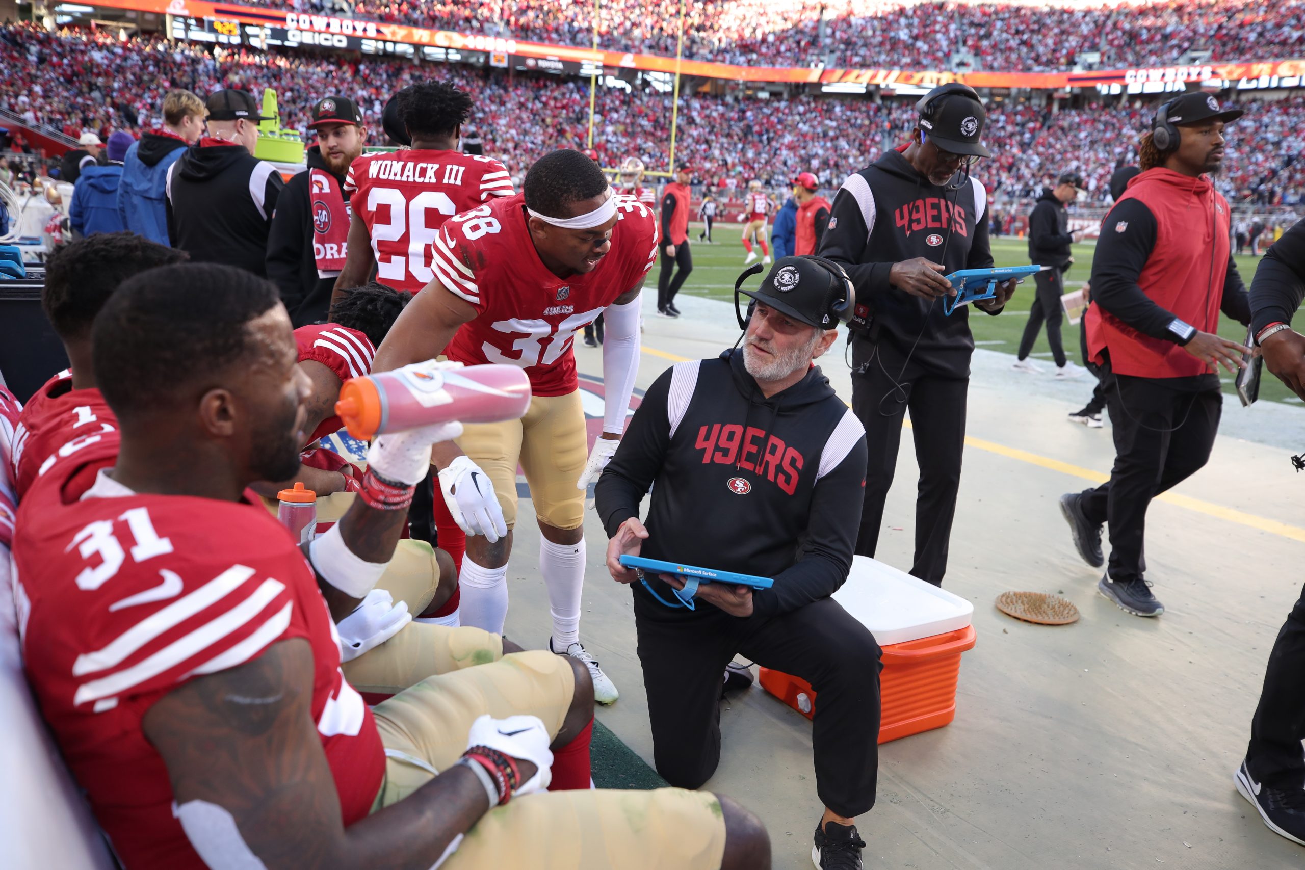 Defensive Pass Game Specialist and Secondary Coach Cory Undlin of the San Francisco 49ers talks wit...