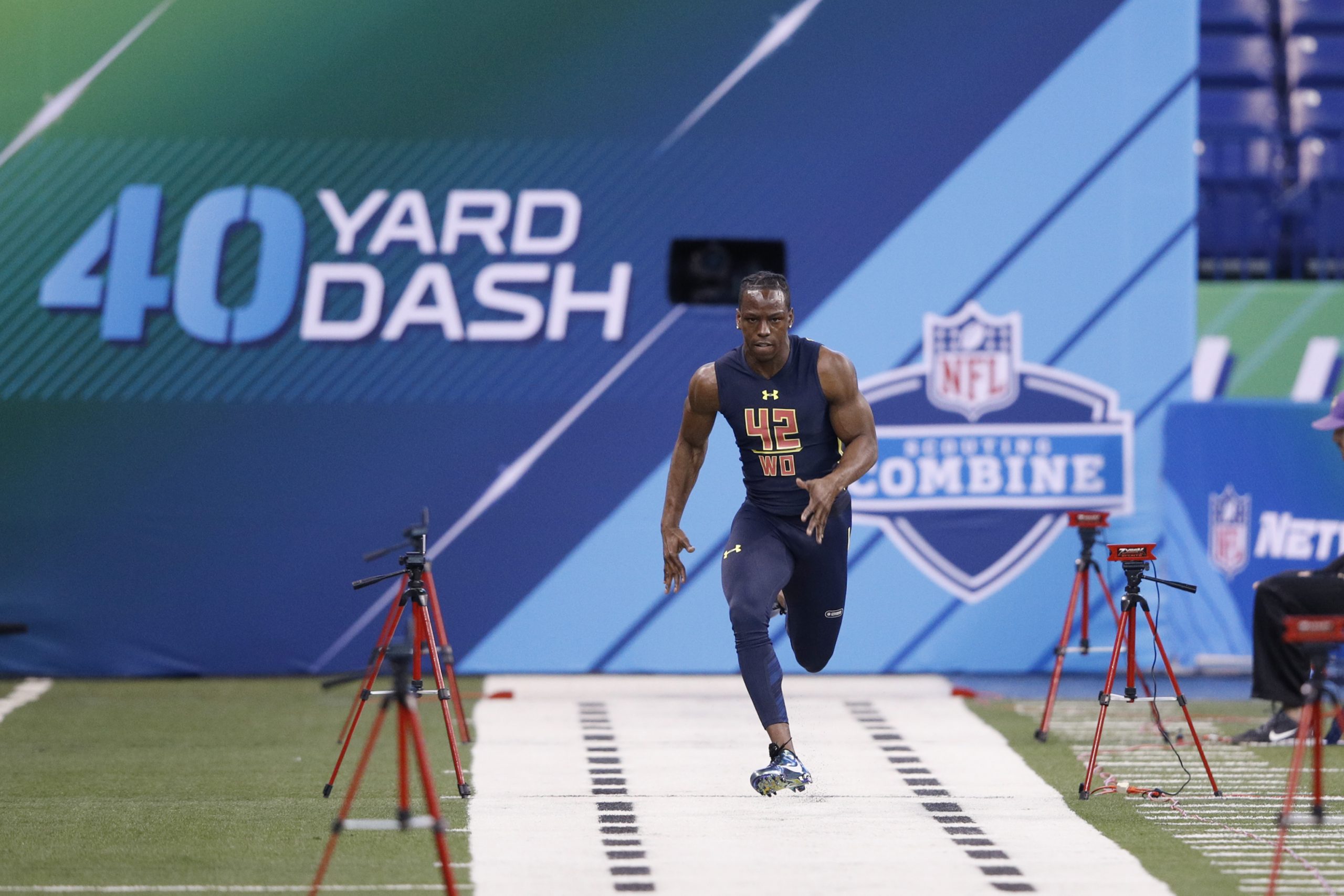 Wide receiver John Ross of Washington runs the 40-yard dash in an unofficial record time of 4.22 se...