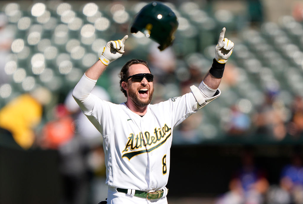 Jed Lowrie #8 of the Oakland Athletics celebrates after hitting a walk-off RBI single scoring Crist...