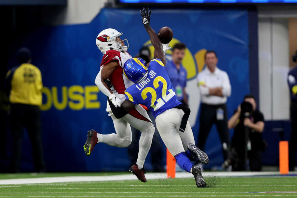 Rondale Moore #4 of the Arizona Cardinals makes the catch against David Long Jr. #22 of the Los Ang...