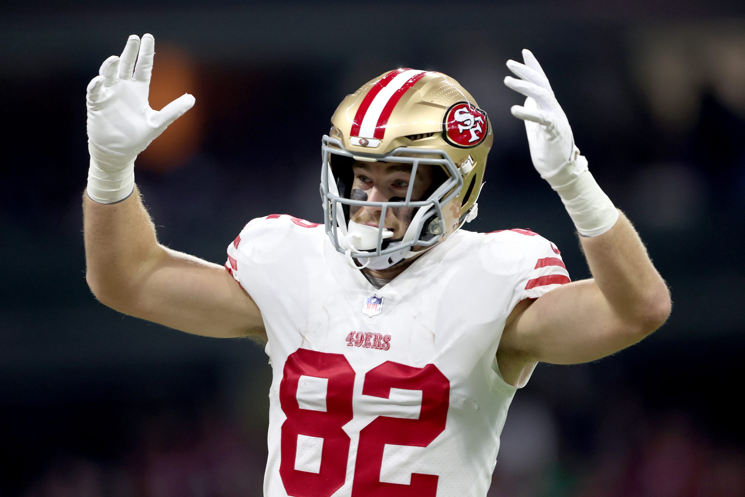 Ross Dwelley #82 of the San Francisco 49ers reacts after a touchdown during the first half of a gam...