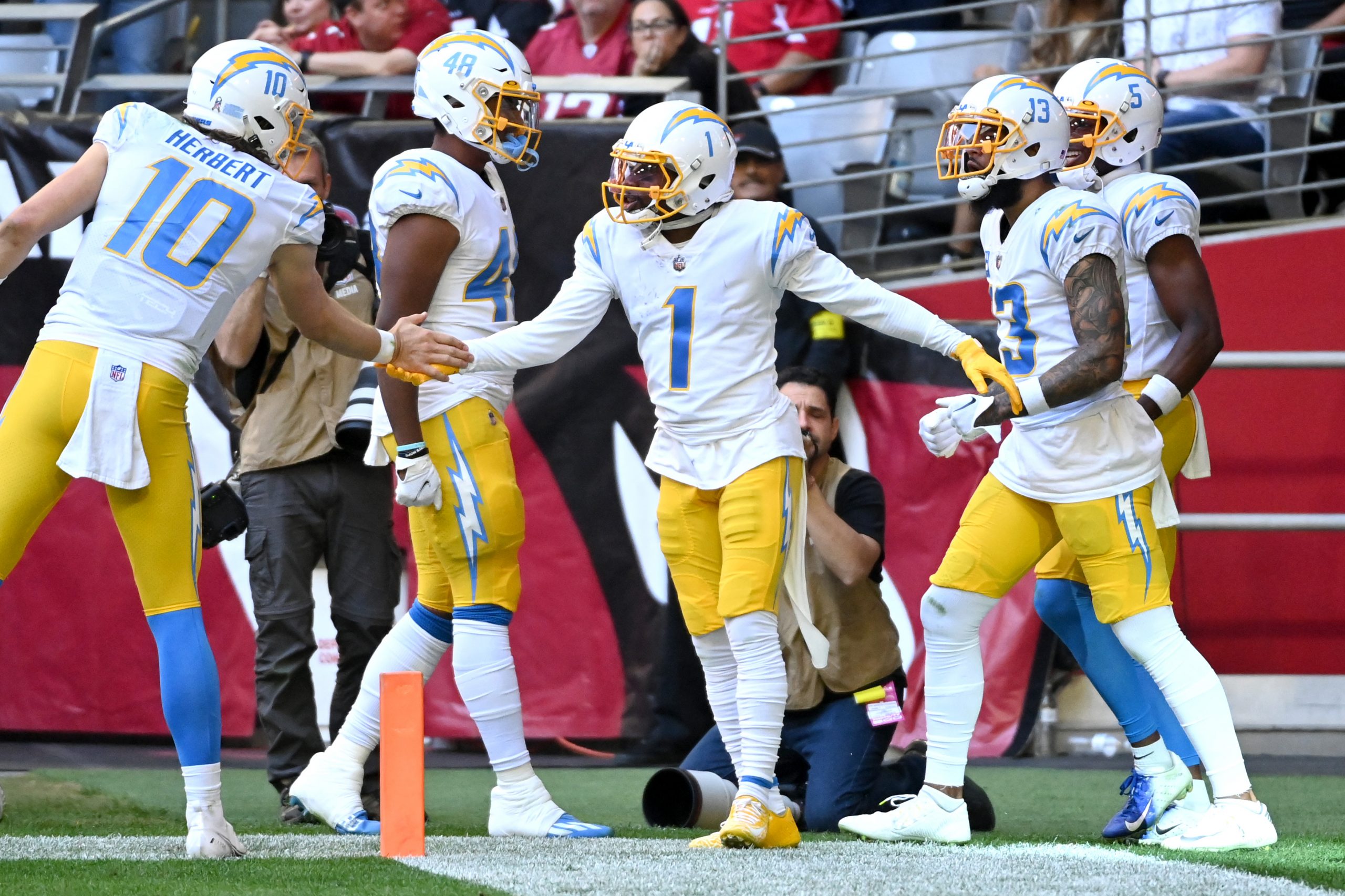 DeAndre Carter #1 of the Los Angeles Chargers celebrates with teammates after scoring a touchdown i...