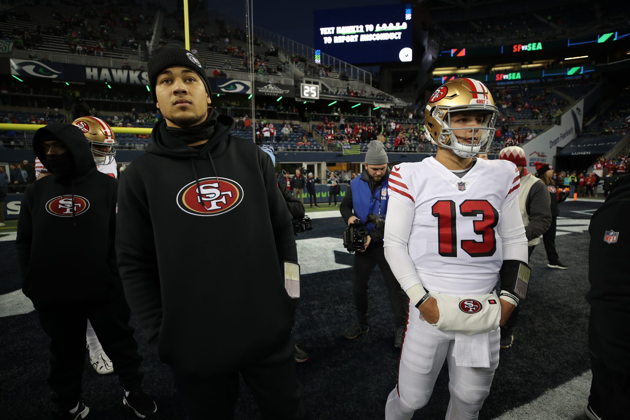 Trey Lance #5 and Brock Purdy #13 of the San Francisco 49ers on the field before the game against t...