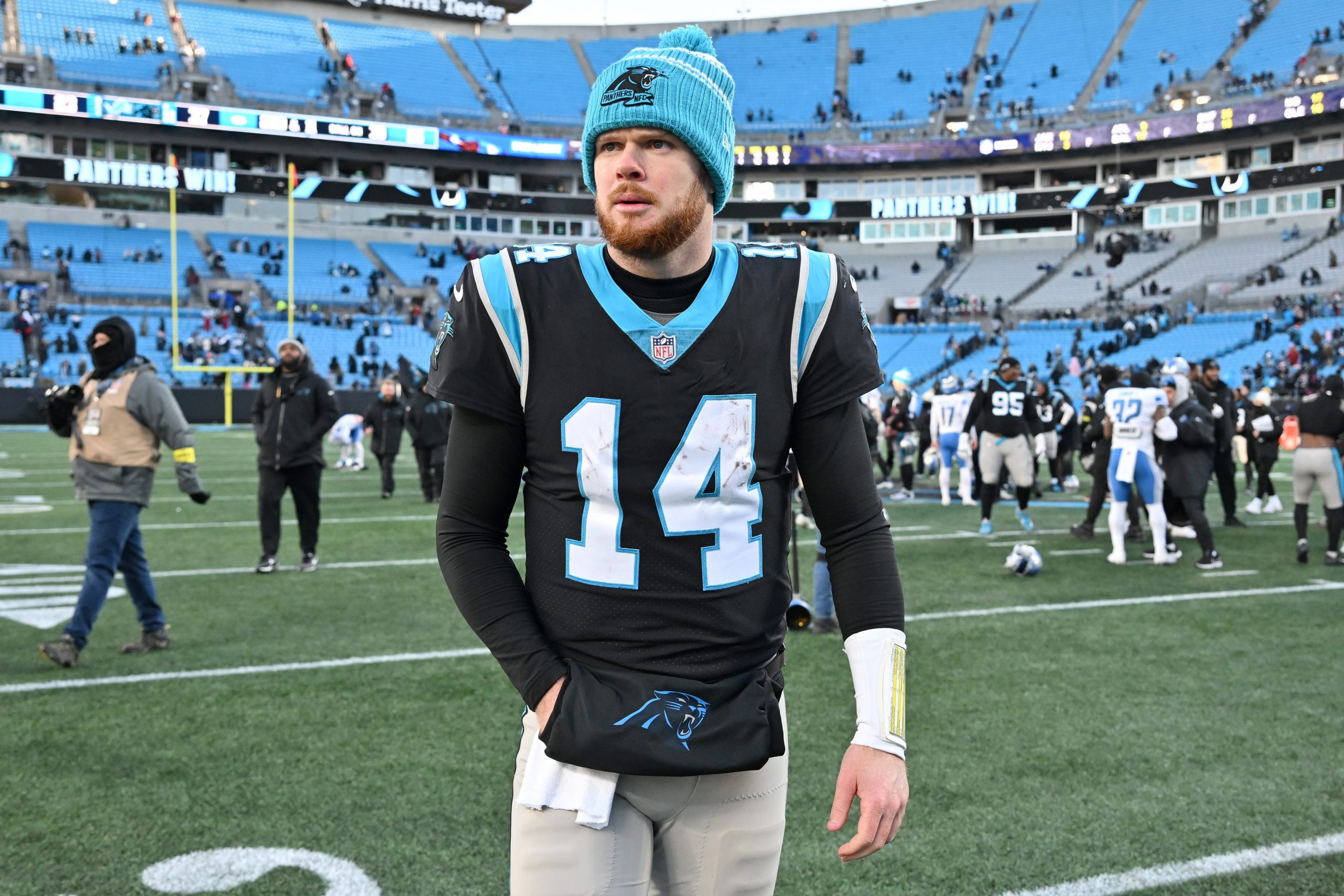 Sam Darnold #14 of the Carolina Panthers walks off the field after defeating the Detroit Lions at B...