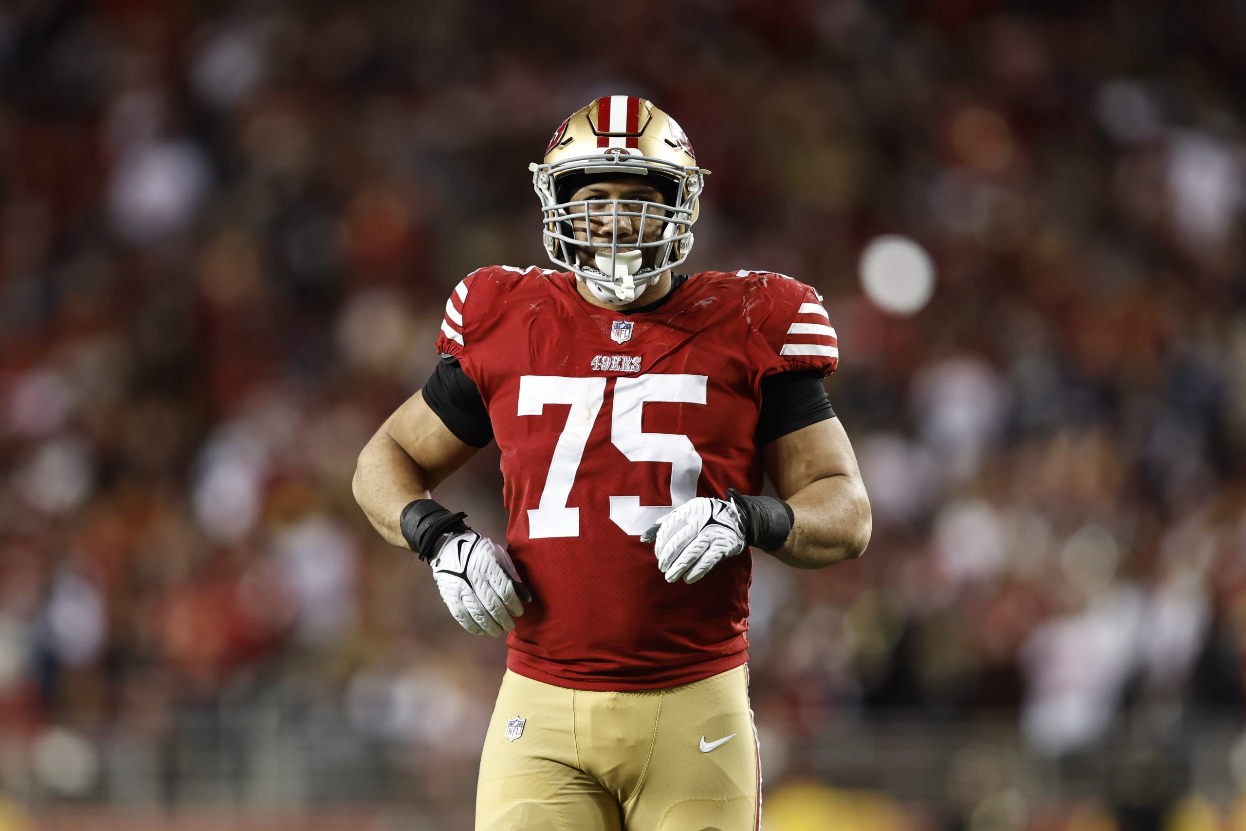 Jordan Willis #75 of the San Francisco 49ers looks on during an NFL divisional round playoff footba...
