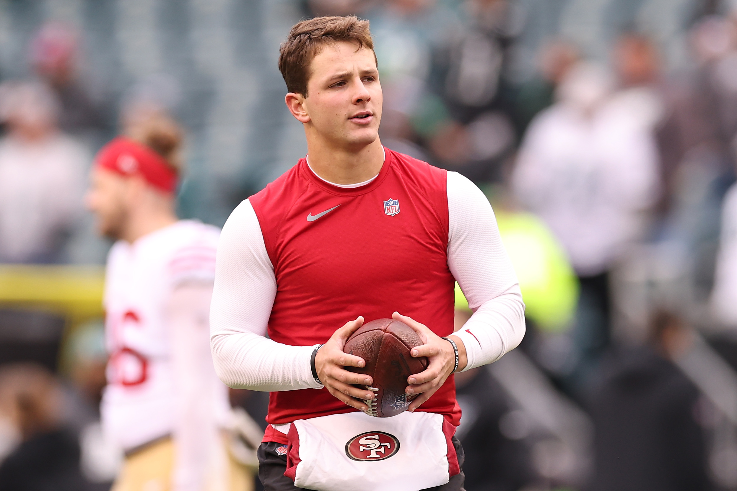 Kyle Shanahan; Brock Purdy #13 of the San Francisco 49ers warms up prior to the NFC Championship Ga...