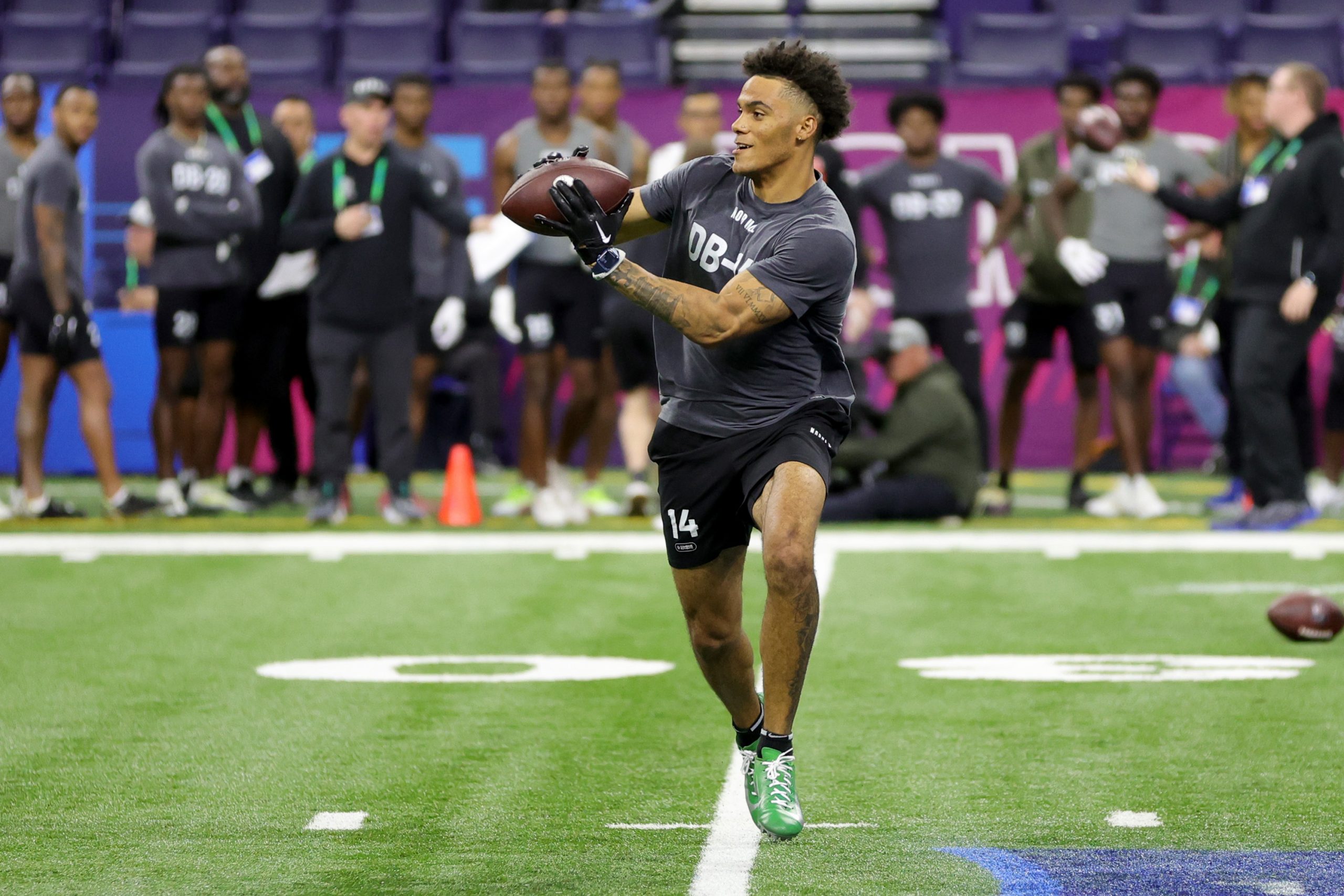 Defensive back Christian Gonzalez of Oregon participates in a drill during the NFL Combine during t...
