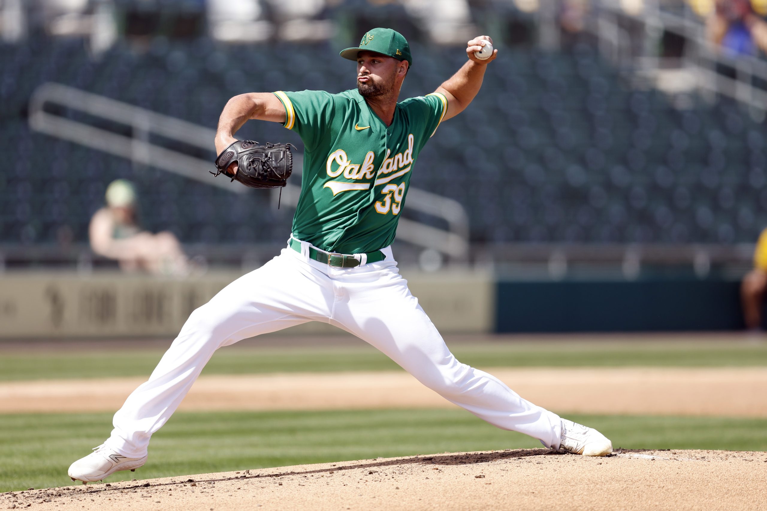 Kyle Muller #39 of the Oakland Athletics pitches during the second inning of a spring training exhi...