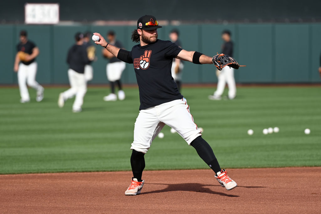 Brandon Crawford #35 of the San Francisco Giants prepares for a Spring Training exhibition game aga...