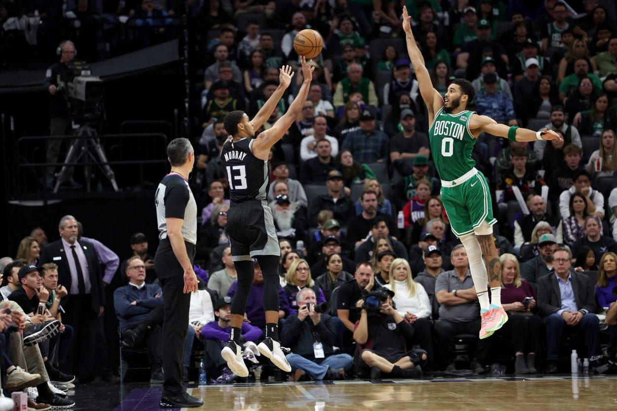 Keegan Murray #13 of the Sacramento Kings shoots over Jayson Tatum #0 of the Boston Celtics in the ...