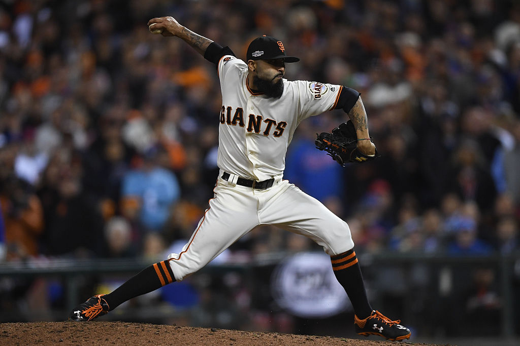 Sergio Romo #54 of the San Francisco Giants delivers a pitch in the ninth inning against the Chicag...