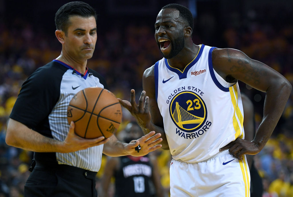 Draymond Green #23 of the Golden State Warriors complains over a technical foul call on him by refe...