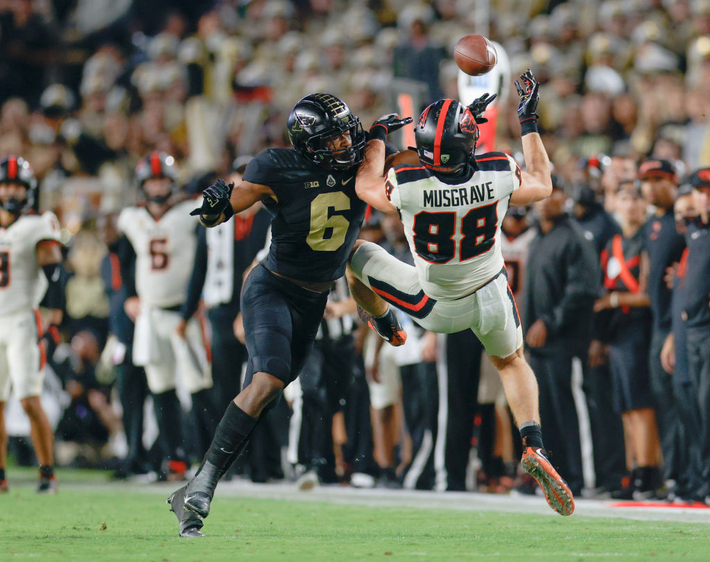 Jalen Graham #6 of the Purdue Boilermakers breaks up the pass intended for Luke Musgrave #88 of the...