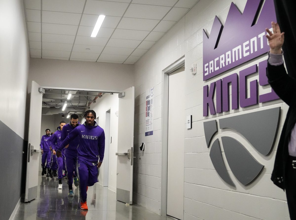 Davion Mitchell #15 of the Sacramento Kings leads the team out from the locker room before playing ...