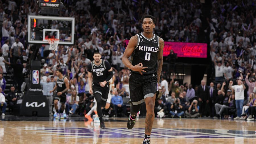 SACRAMENTO, CALIFORNIA - APRIL 15: Malik Monk #0 of the Sacramento Kings celebrates making a three-pointer against the Golden State Warriors during the fourth quarter in Game One of the Western Conference First Round Playoffs at the Golden 1 Center on April 15, 2023 in Sacramento, California. NOTE TO USER: User expressly acknowledges and agrees that, by downloading and or using this photograph, User is consenting to the terms and conditions of the Getty Images License Agreement. (Photo by Loren Elliott/Getty Images)