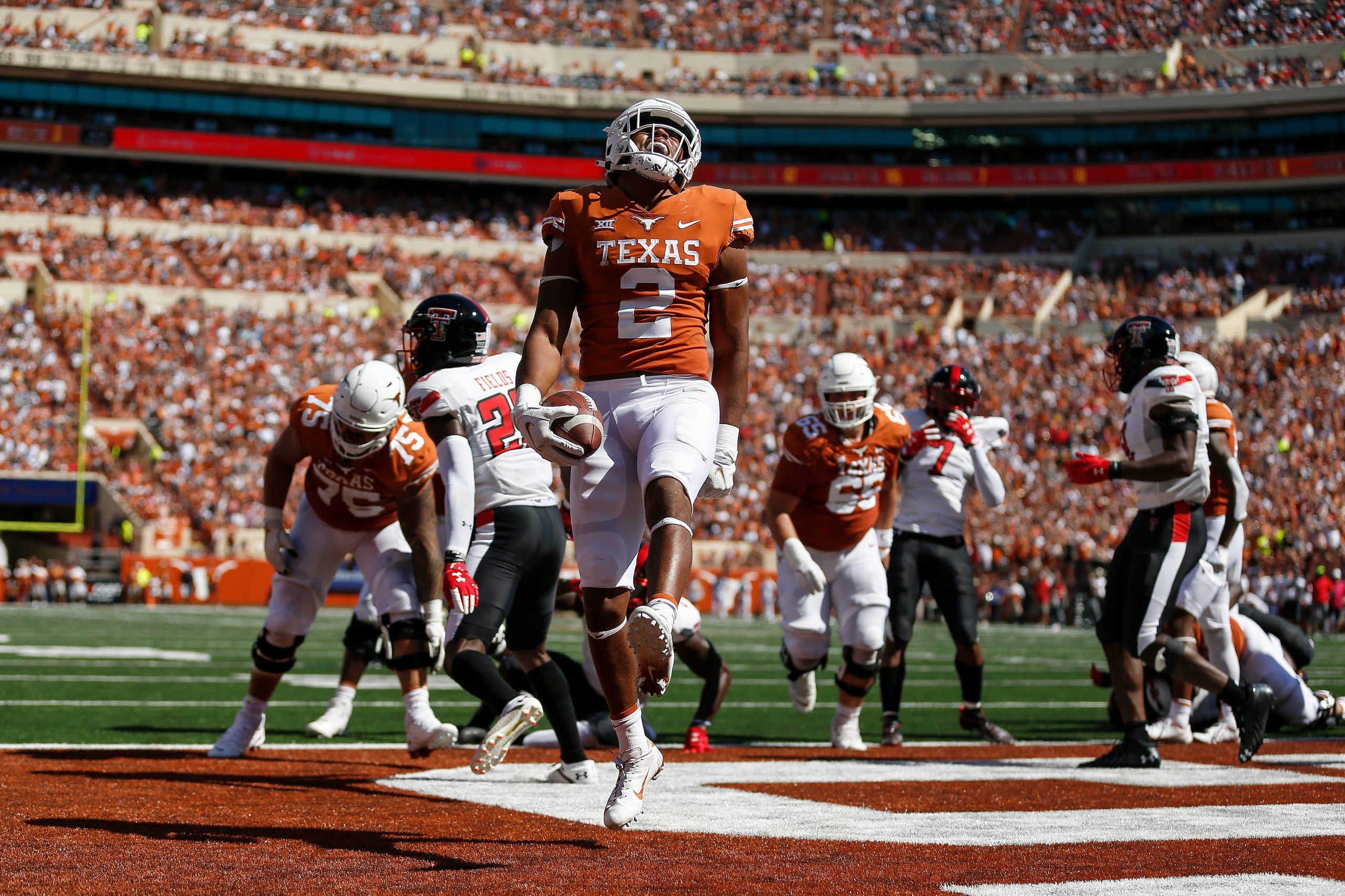 Roschon Johnson #2 of the Texas Longhorns scores a touchdown in the first quarter against the Texas...