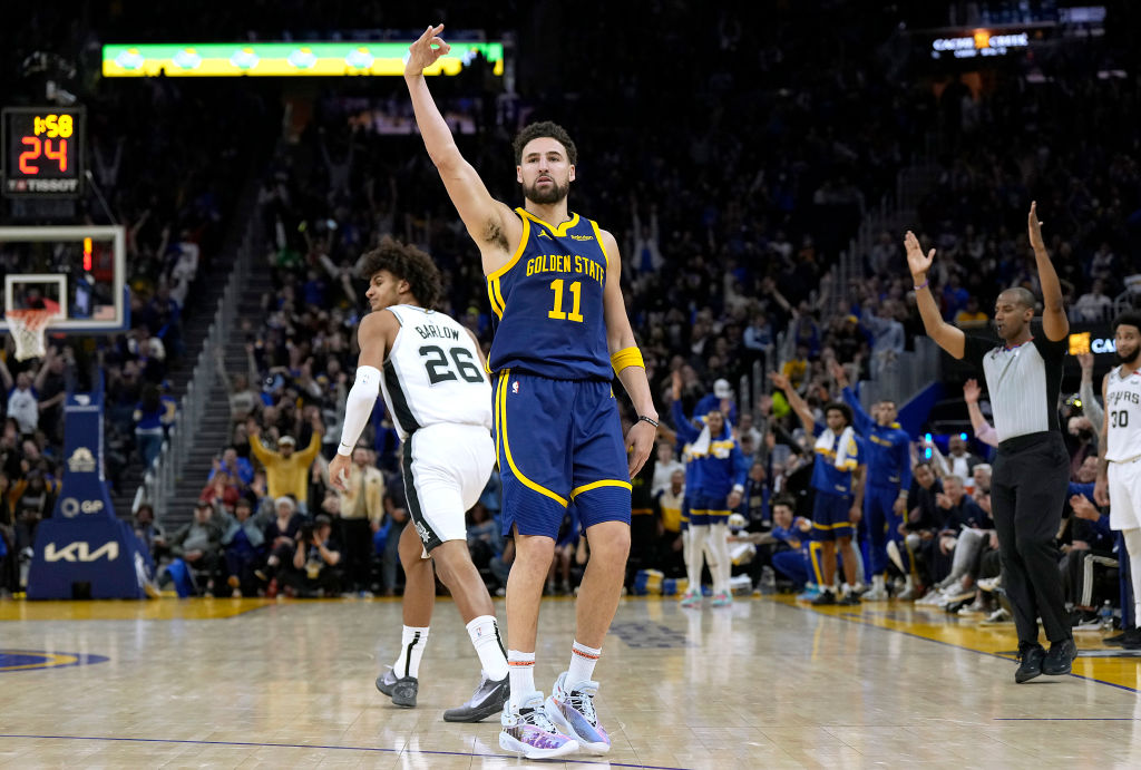 Klay Thompson #11 of the Golden State Warriors reacts after making a three-point shot against the S...