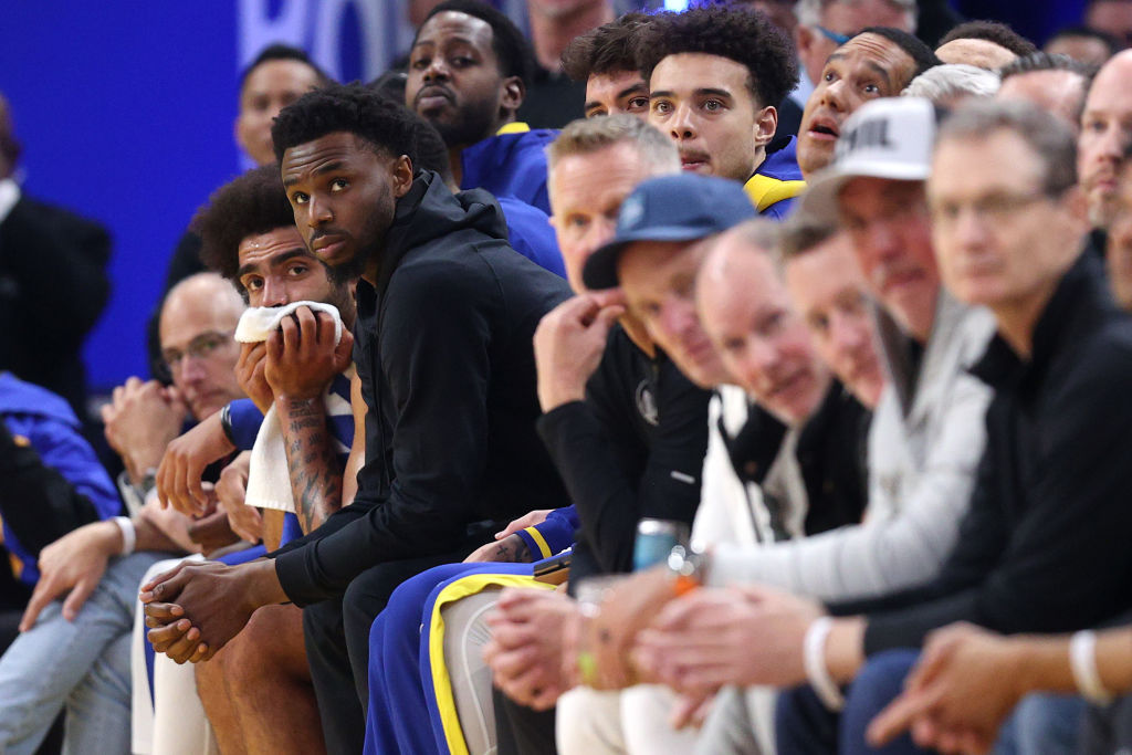 Andrew Wiggins #22 of the Golden State Warriors, who has been out for personal reasons, sits on the...