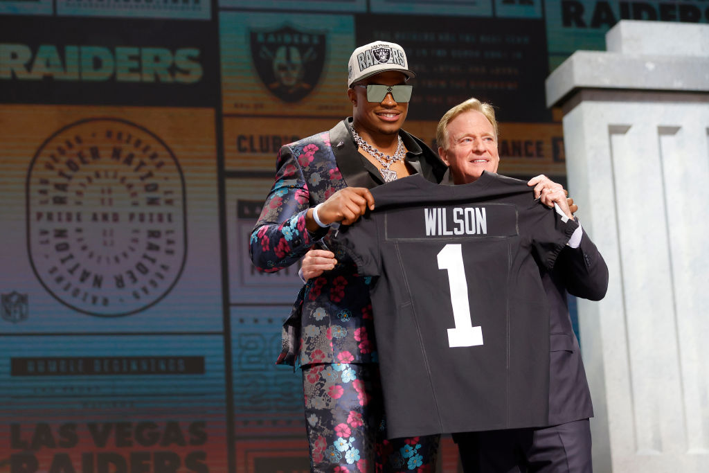 Tyree Wilson poses with NFL Commissioner Roger Goodell after being selected seventh overall by the ...