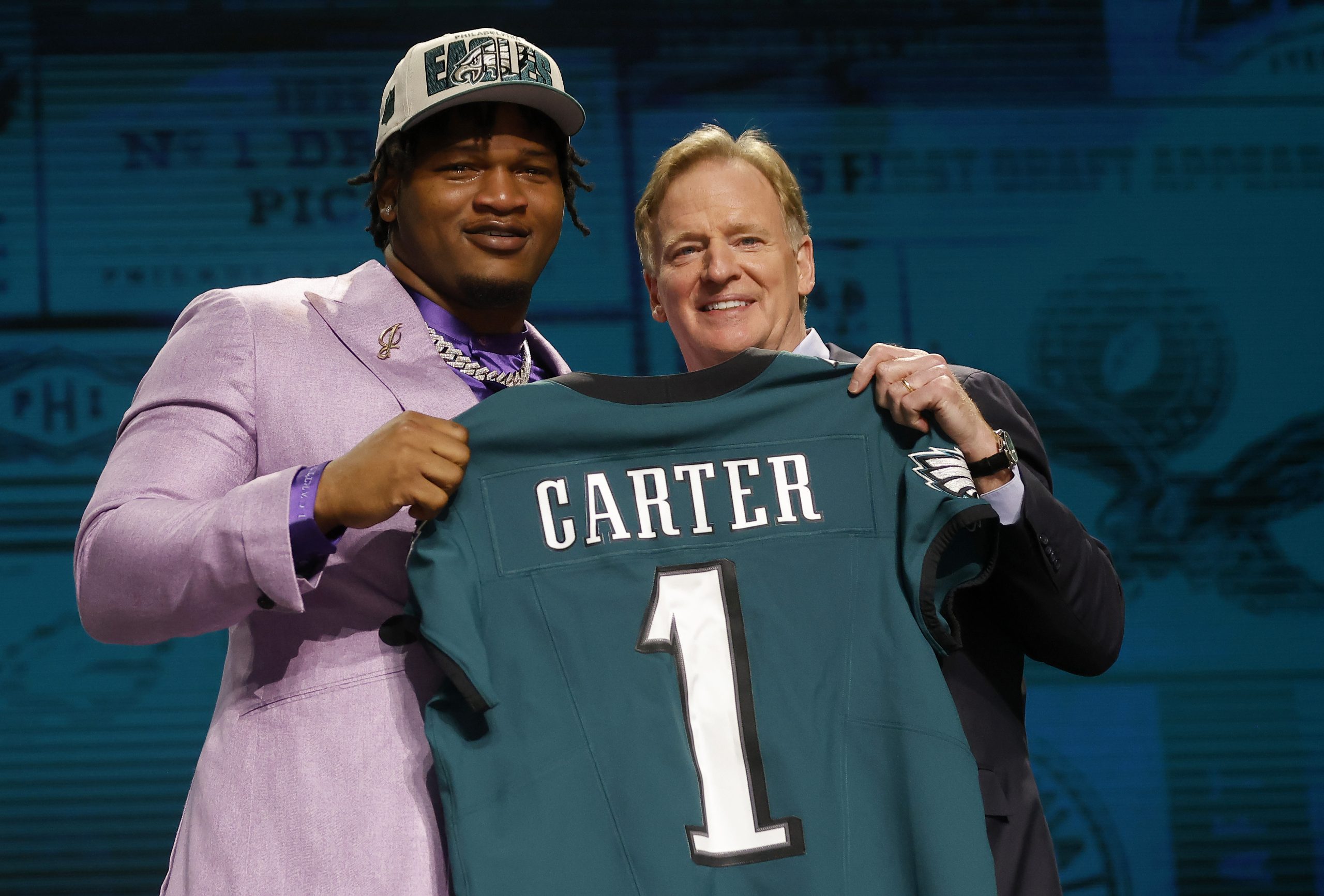 (L-R) Jalen Carter poses with NFL Commissioner Roger Goodell after being selected ninth overall by ...