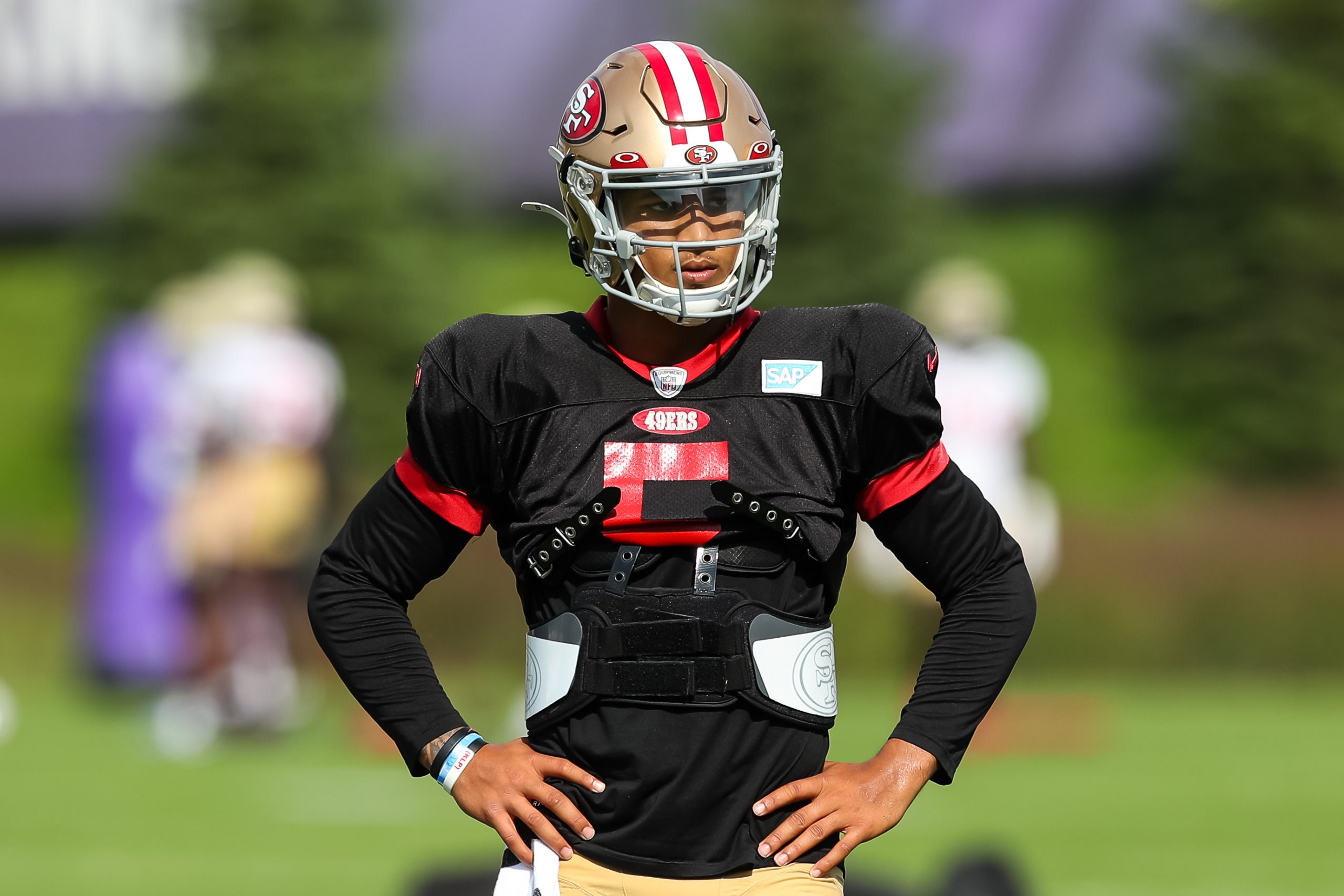 Trey Lance #5 of the San Francisco 49ers looks on during a joint practice with the Minnesota Viking...