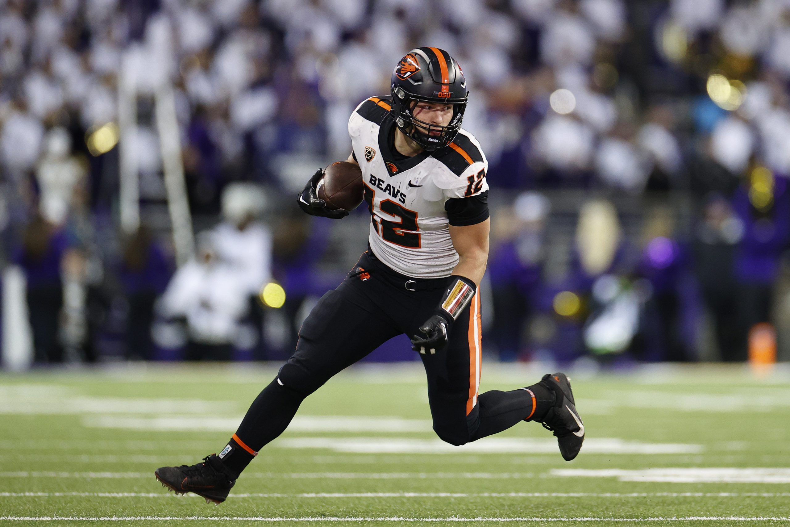 Jack Colletto #12 of the Oregon State Beavers carries the ball against the Washington Huskies durin...