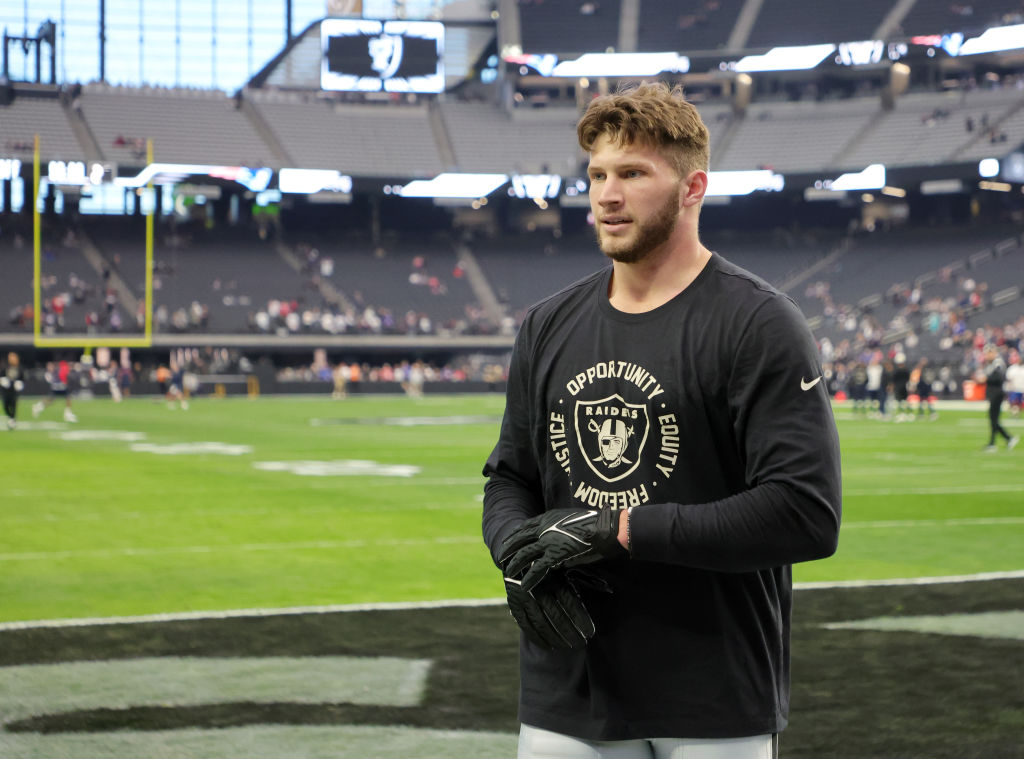 Tight end Foster Moreau #87 of the Las Vegas Raiders warms up before a game against the New England...