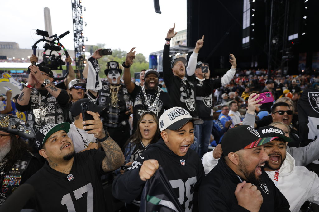 Las Vegas Raiders fans react to their teams selection in the second round of the 2023 NFL Draft at ...