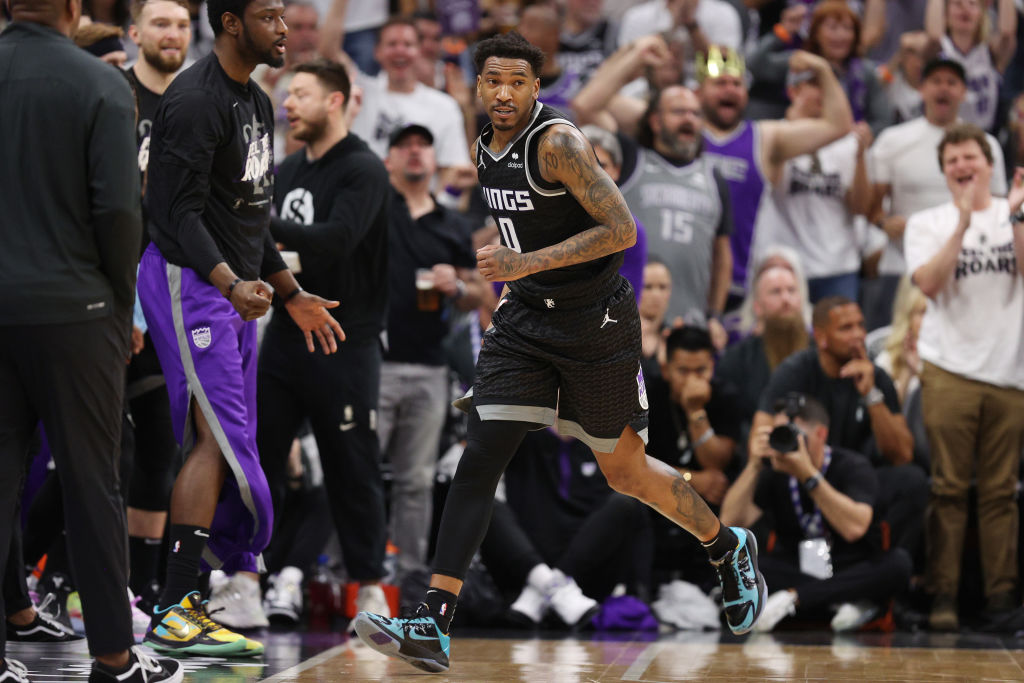 Malik Monk #0 of the Sacramento Kings reacts after scoring during the third quarter in game seven o...