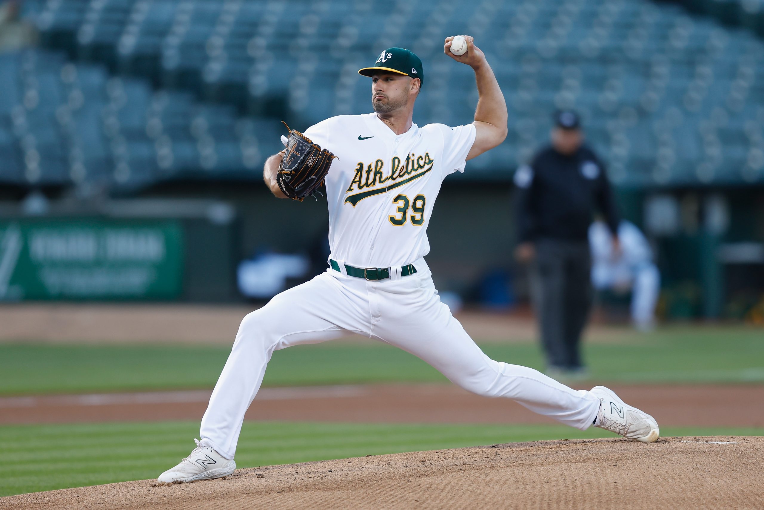 Kyle Muller #39 of the Oakland A's pitches in the top of the first inning against the Arizona Diamo...