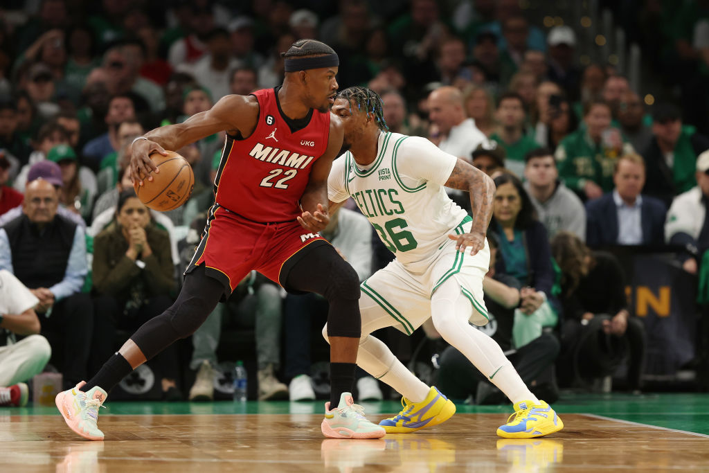 BOSTON, MASSACHUSETTS - MAY 17: Jimmy Butler #22 of the Miami Heat is defended by Marcus Smart #36 ...