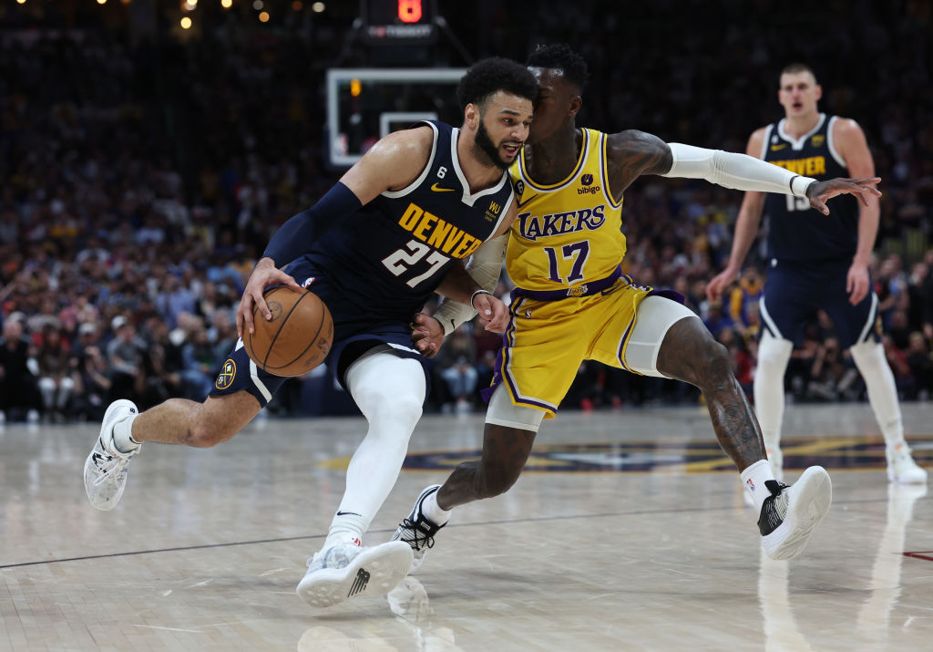 Jamal Murray #27 of the Denver Nuggets drives against Dennis Schroder #17 of the Los Angeles Lakers...
