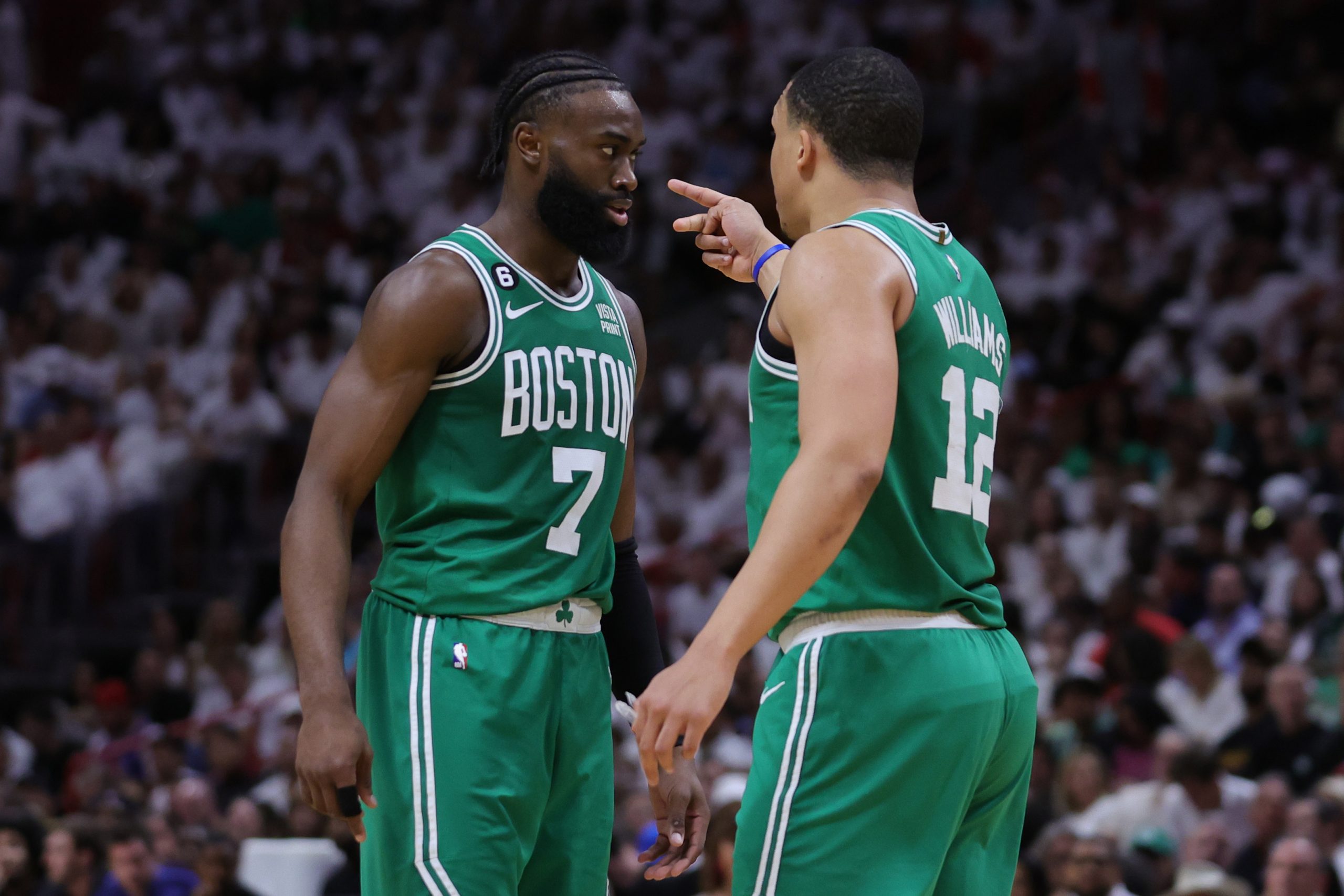 MIAMI, FLORIDA - MAY 23: Jaylen Brown #7 and Grant Williams #12 of the Boston Celtics interact agai...