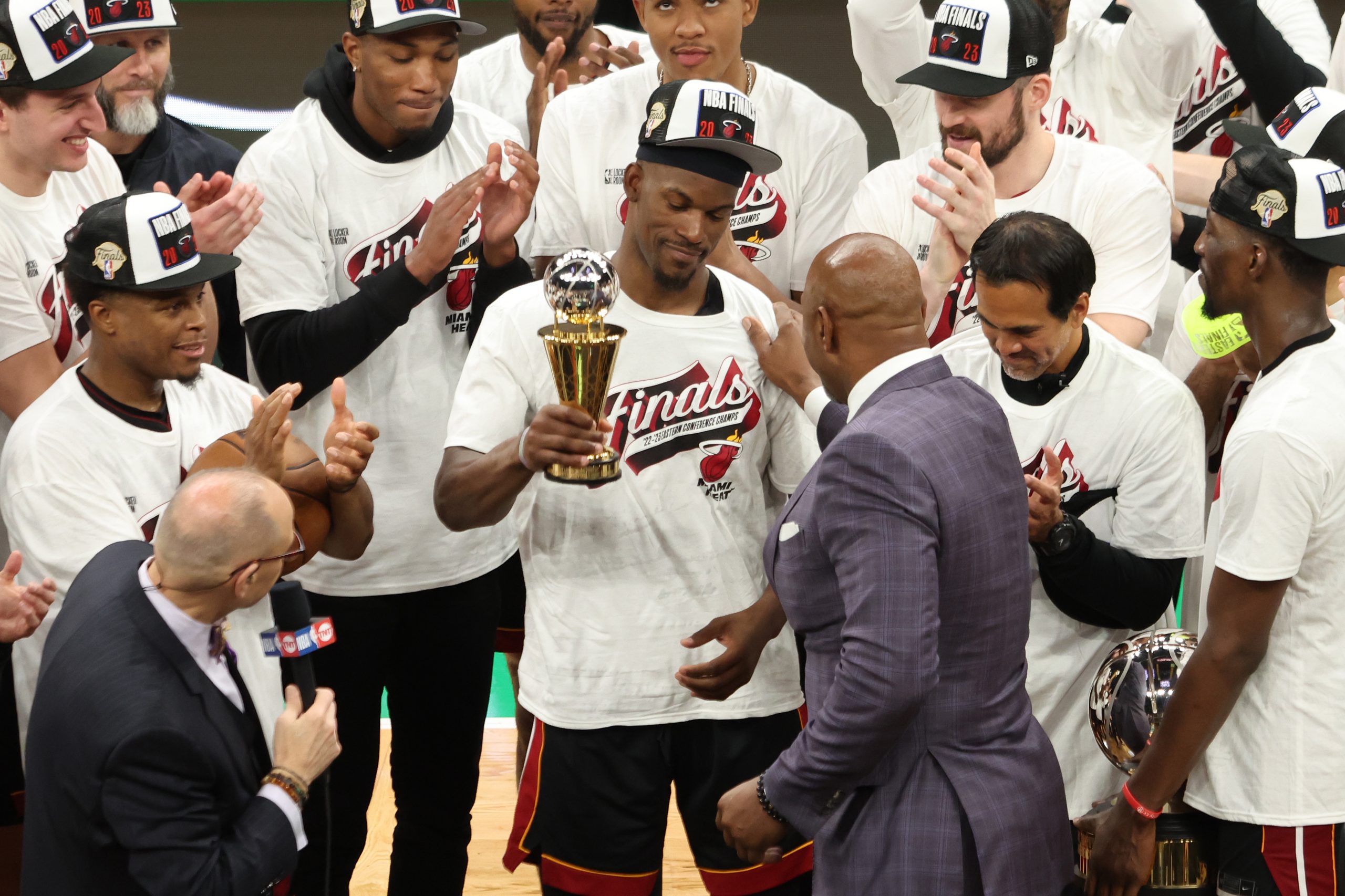 Alonzo Mourning presents Jimmy Butler #22 of the Miami Heat with the Larry Bird Trophy after Butler...