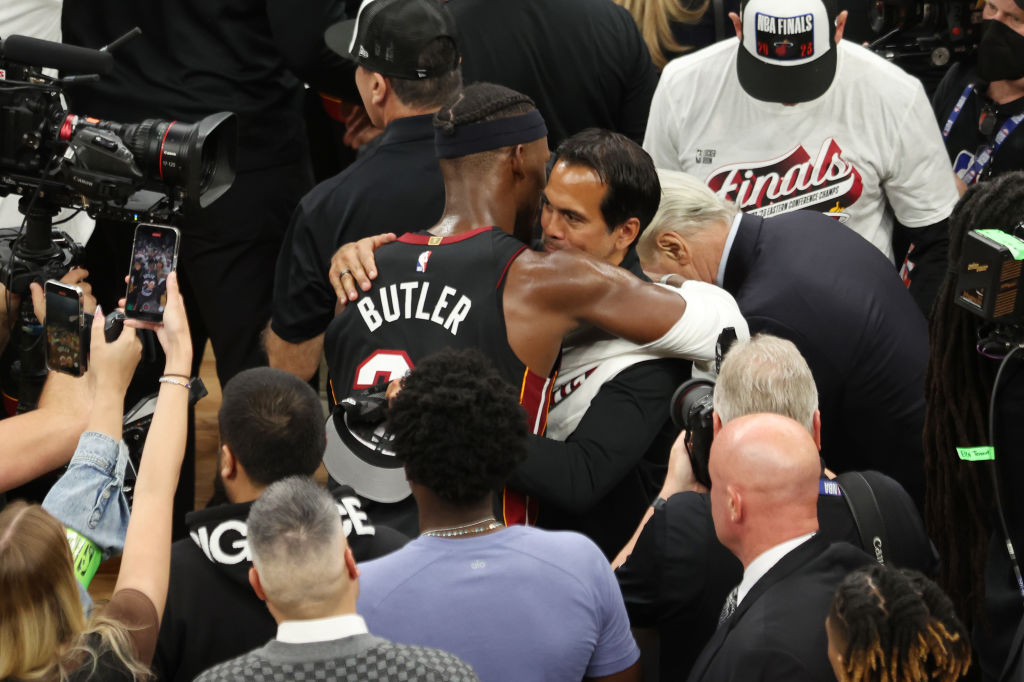 BOSTON, MASSACHUSETTS - MAY 29: Jimmy Butler #22 of the Miami Heat hugs head coach Erik Spoelstra a...