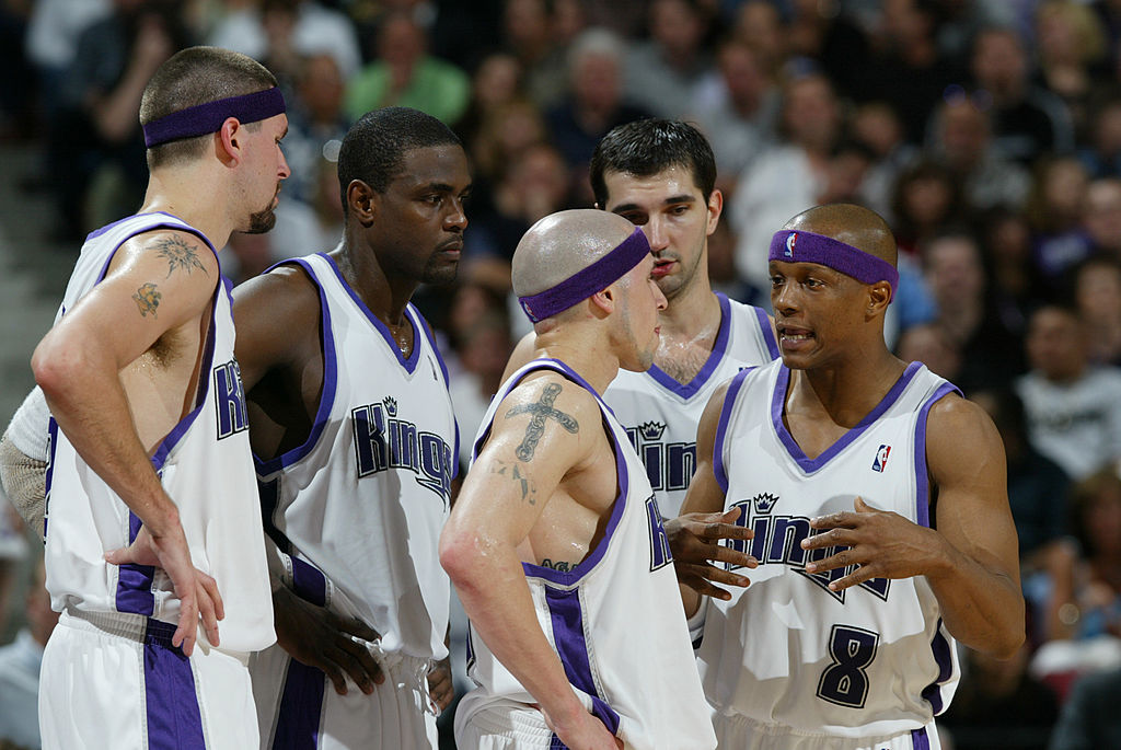 SACRAMENTO, CA - MAY 12: (Left to Right) Brad Miller #52 of the Sacramento Kings huddles with Chris...