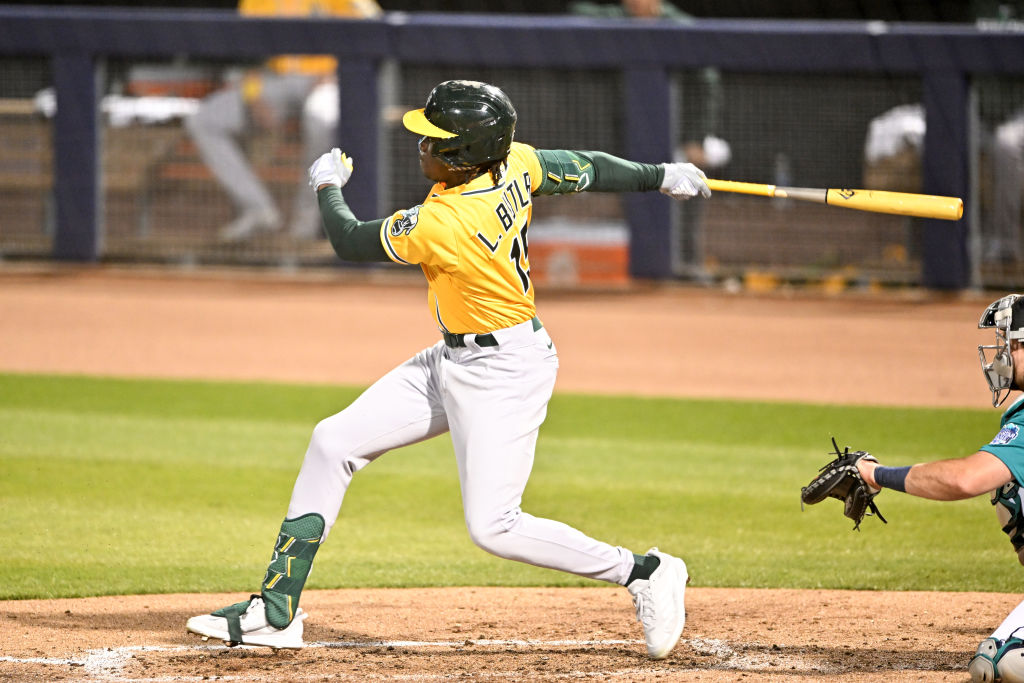 Lawrence Butler #15 of the Oakland Athletics bats during the second inning of a spring training gam...