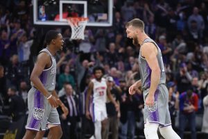 SACRAMENTO, CALIFORNIA - NOVEMBER 20: De'Aaron Fox #5 and Domantas Sabonis #10 of the Sacramento Kings celebrate after a three-point basket in the fourth quarter against the Detroit Pistons at Golden 1 Center on November 20, 2022 in Sacramento, California. NOTE TO USER: User expressly acknowledges and agrees that, by downloading and/or using this photograph, User is consenting to the terms and conditions of the Getty Images License Agreement. (Photo by Lachlan Cunningham/Getty Images)