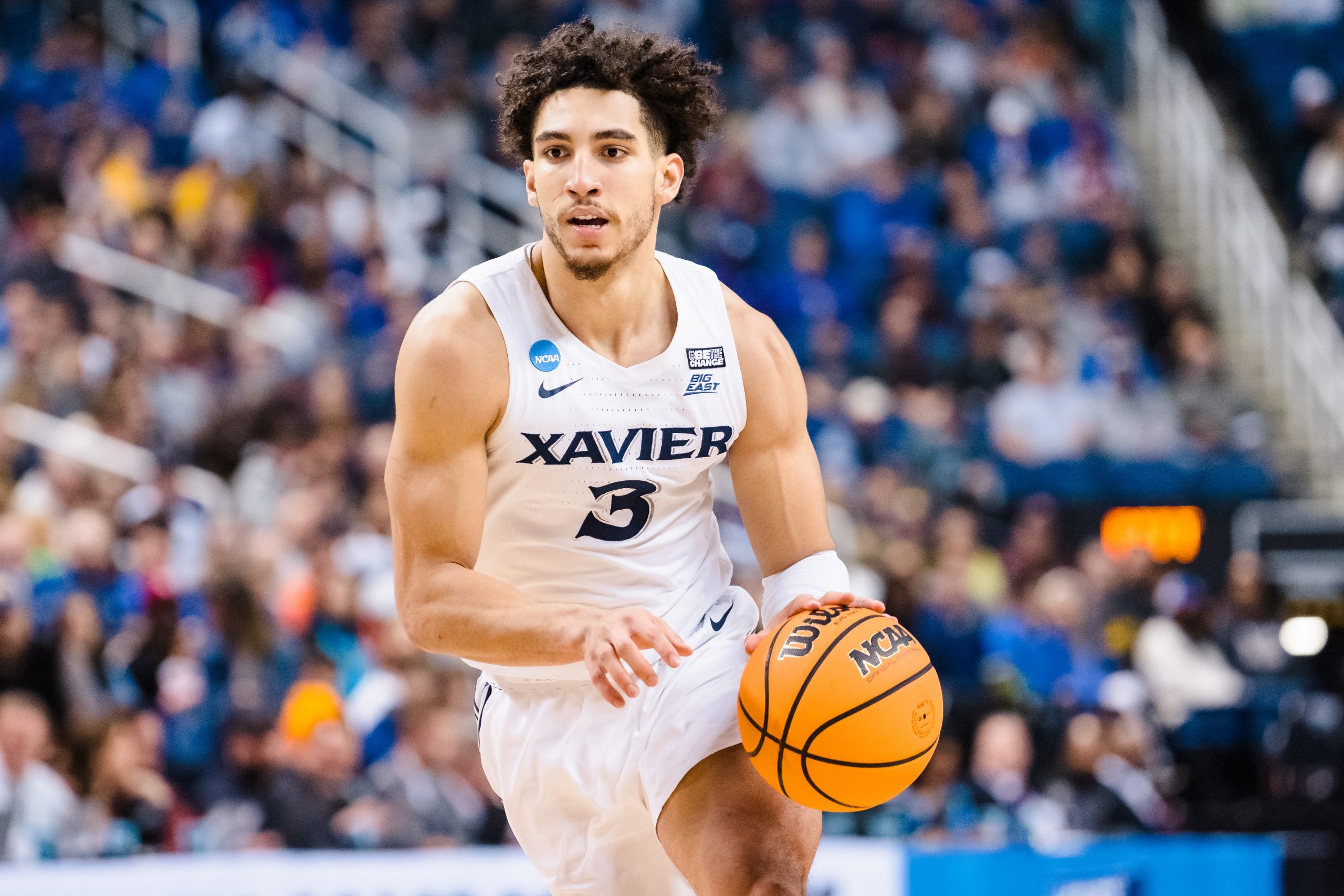 Colby Jones #3 of the Xavier Musketeers brings the ball up court against the Pittsburgh Panthers in...