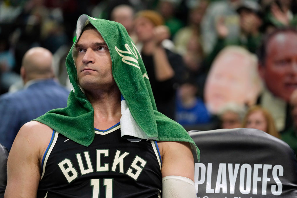 Brook Lopez #11 of the Milwaukee Bucks sits on the bench during the first half of Game Two of the E...