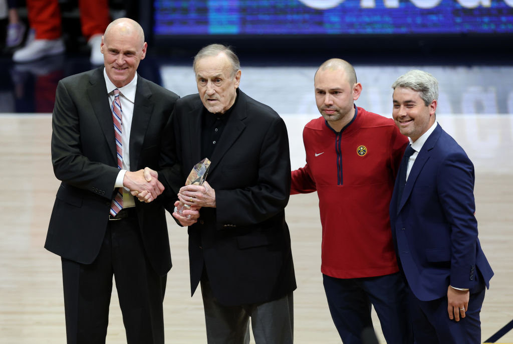 Rick Adelman (2L) is honored with the Chuck Daly Lifetime Achievement Award during Game Two of the ...