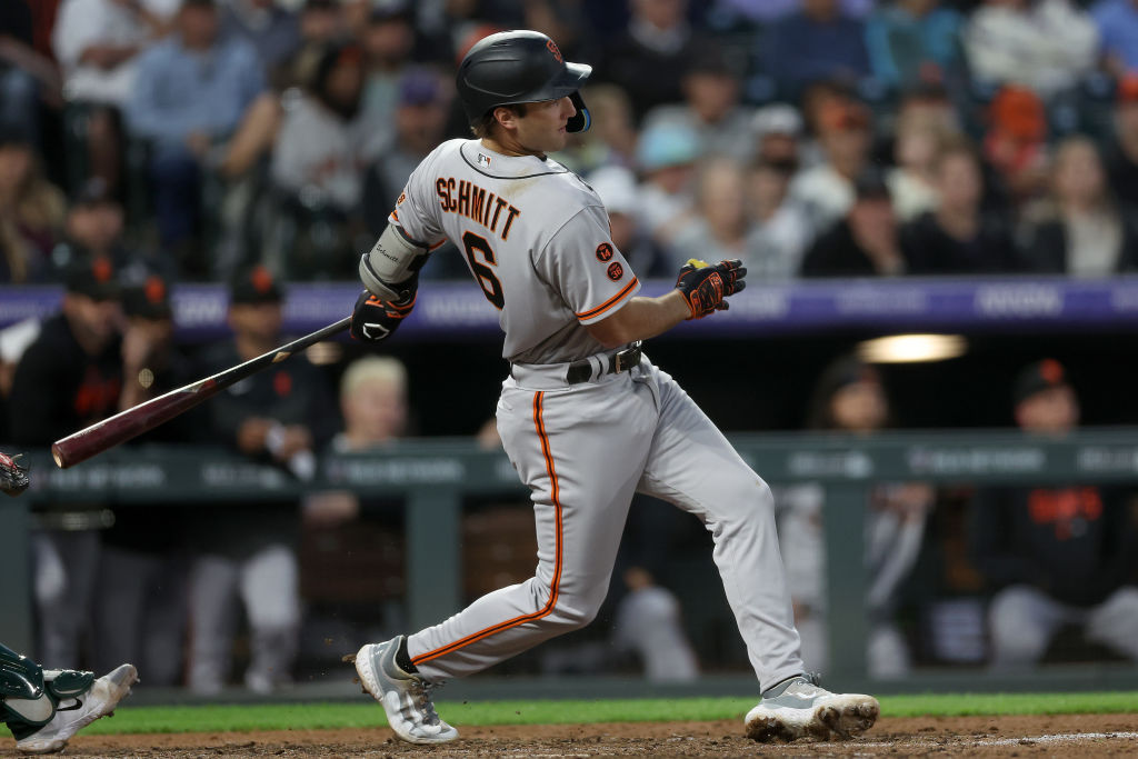 Casey Schmitt #6 of the San Francisco Giants hits a 2 RBI single against the Colorado Rockies in th...