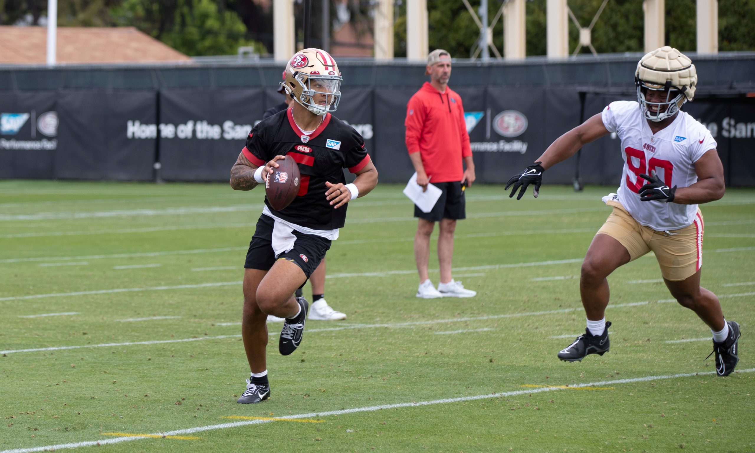 Trey Lance #5 of the San Francisco 49ers rolls out during mandatory minicamp at the SAP Performance...