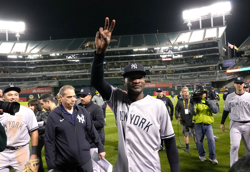 Domingo German #0 of the New York Yankees celebrates his no-hit perfect game against the Oakland At...